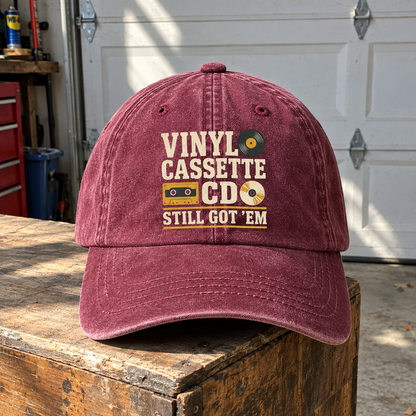 Burgundy vintage washed cap with printed Vinyl Cassette CD Still Got 'Em slogan, hero view