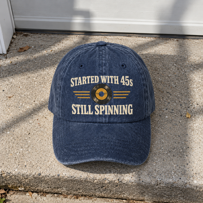 Navy vintage washed cap with printed Started With 45s Still Spinning slogan, front view