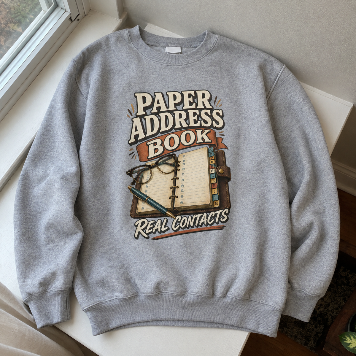 Gray vintage sweatshirt with printed Paper Address Book Real Contacts design, front hero view