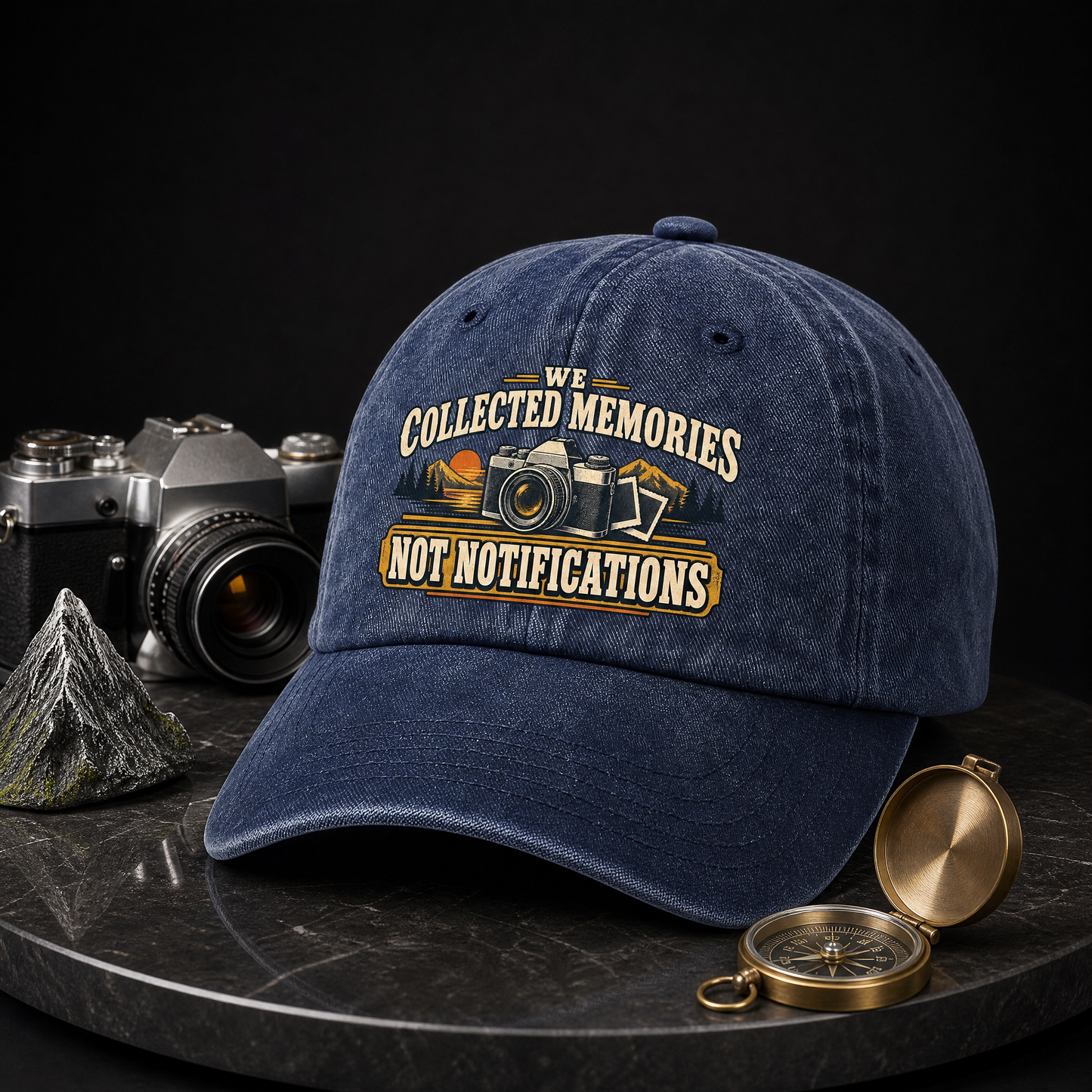 Navy vintage washed cap with printed “We Collected Memories Not Notifications” design, hero view