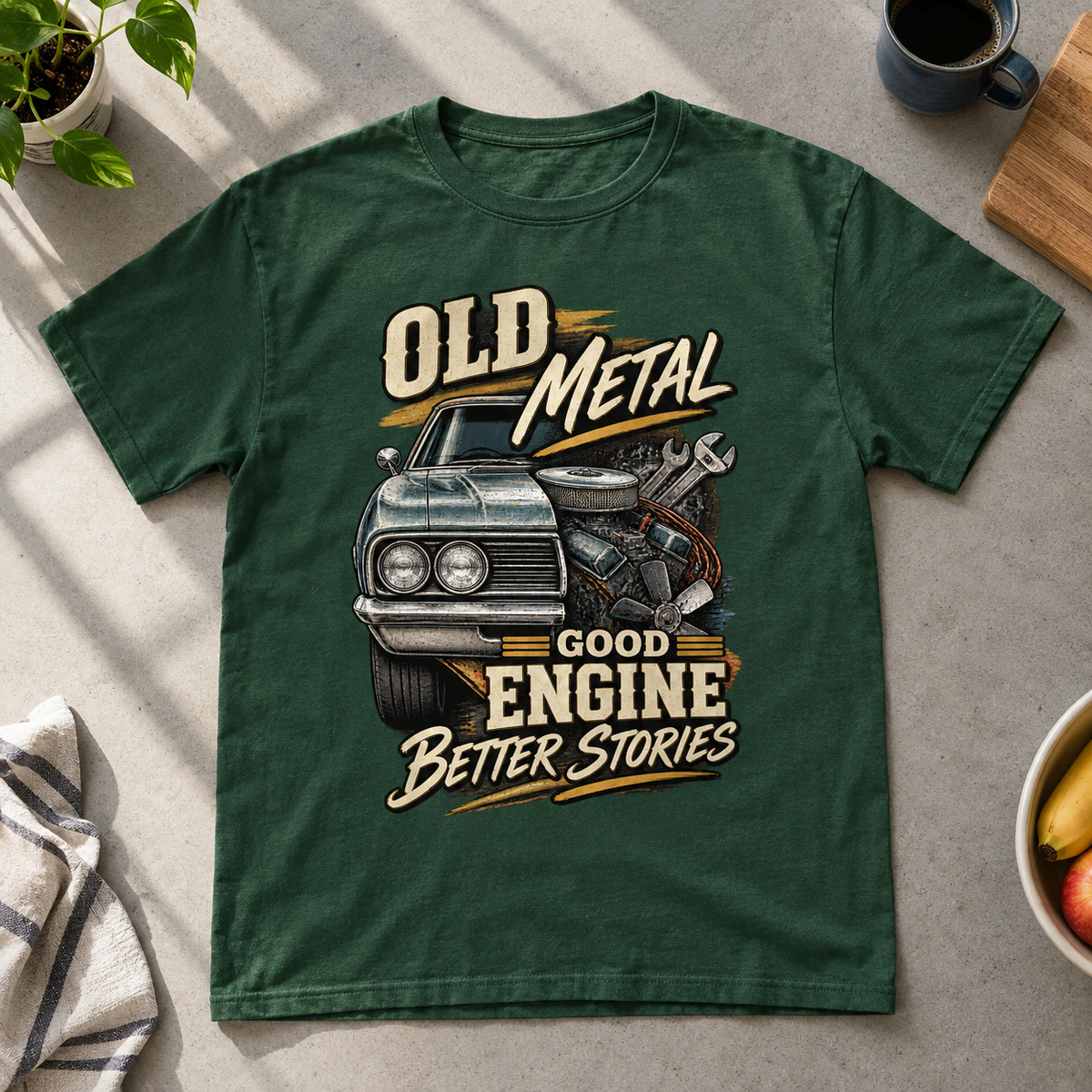 Green vintage t-shirt with printed Old Metal Good Engine Better Stories slogan and car graphic