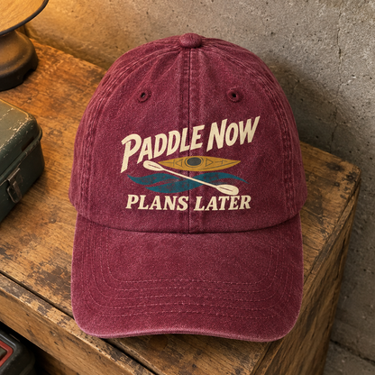 Burgundy vintage washed cap with printed Paddle Now Plans Later slogan, front hero view