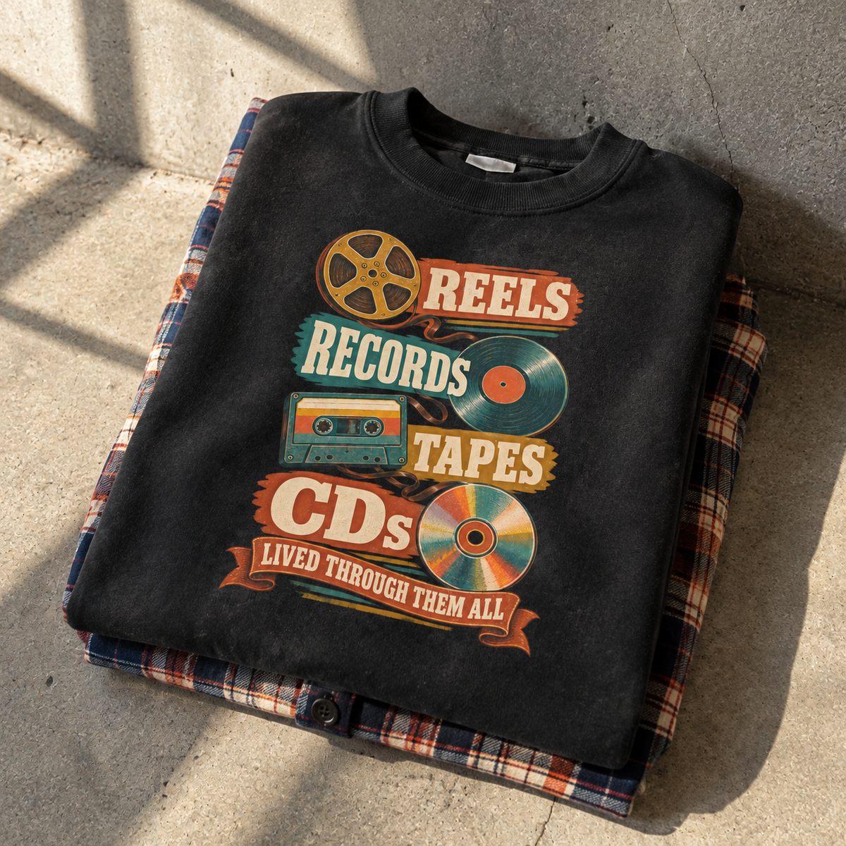 Black vintage sweatshirt featuring printed Reels Records Tapes CDs Lived Through Them All design