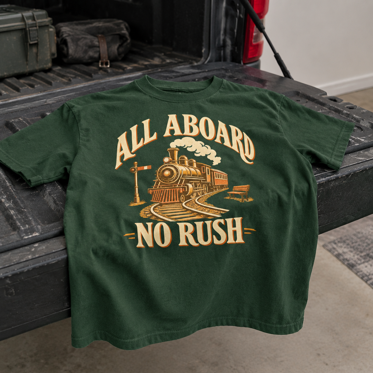 Green vintage t-shirt with printed All Aboard No Rush train design, hero view