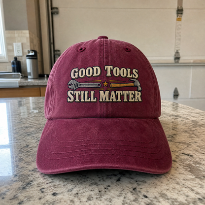 Maroon vintage washed cap with printed Good Tools Still Matter slogan and tool graphics.
