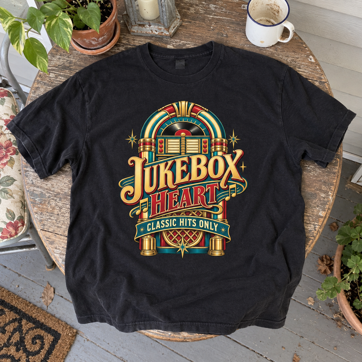 Black vintage t-shirt laid flat with colorful jukebox and printed Jukebox Heart Classic Hits Only