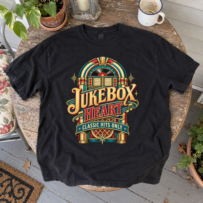 Black vintage t-shirt laid flat with colorful jukebox and printed Jukebox Heart Classic Hits Only