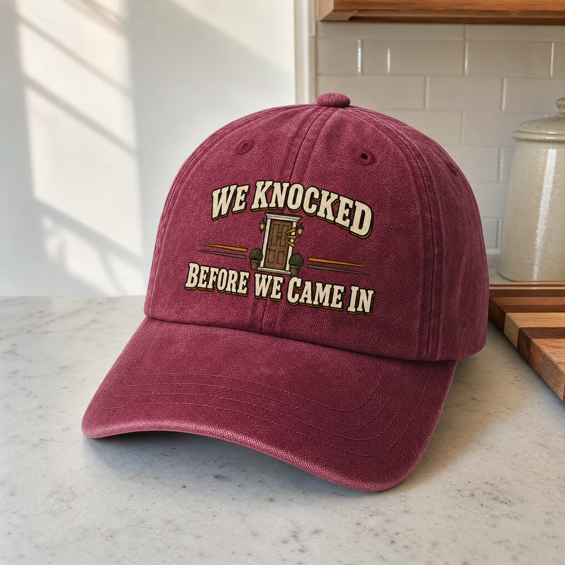 Burgundy vintage washed cap with printed “We Knocked Before We Came In” slogan, hero view.