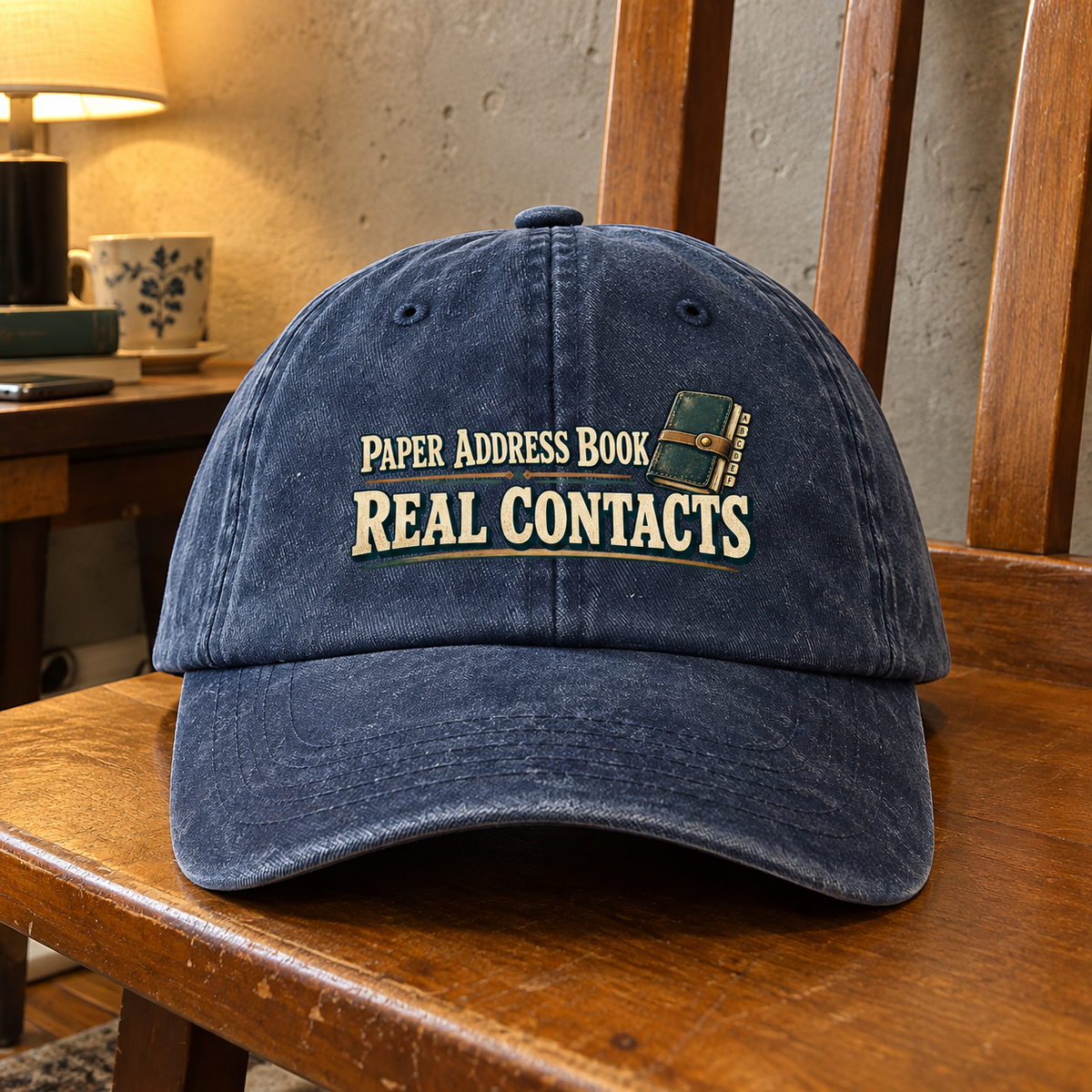 Navy vintage washed cap with printed Paper Address Book Real Contacts slogan, front hero view