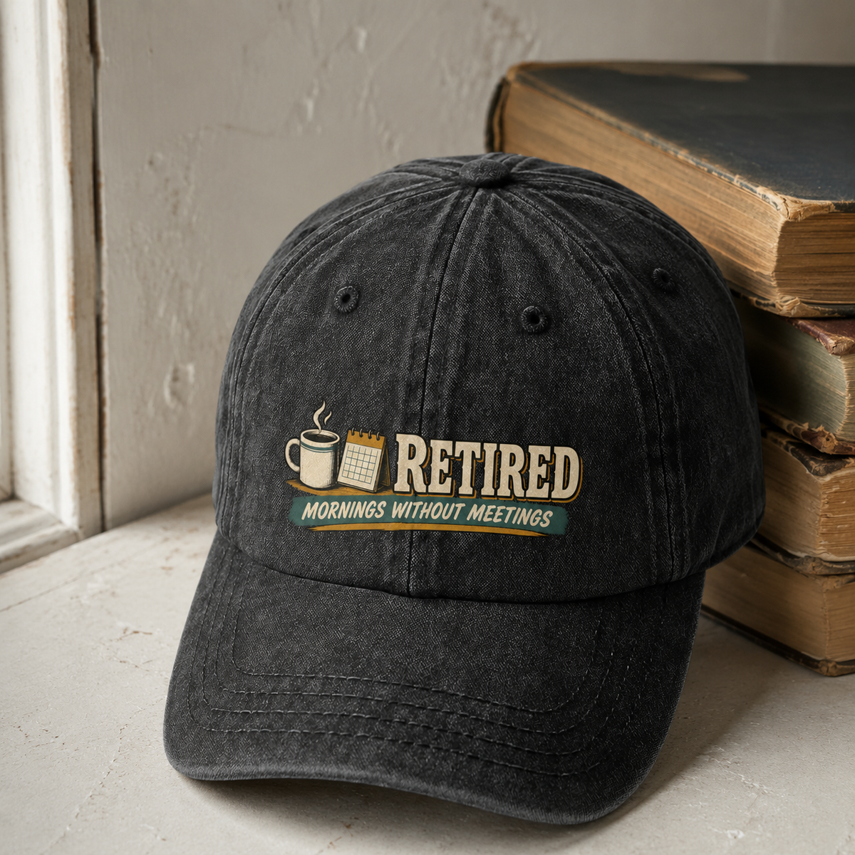 Black vintage washed cap with printed Retired Mornings Without Meetings slogan on front