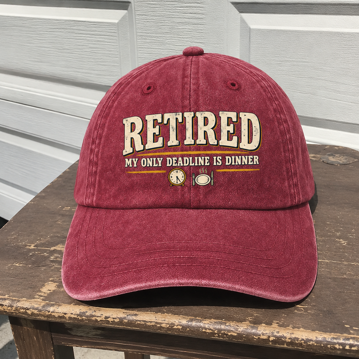 Red vintage washed cap with printed RETIRED My Only Deadline Is Dinner slogan front view