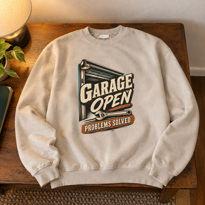 Beige vintage sweatshirt with printed Garage Open Problems Solved design, shown from overhead view