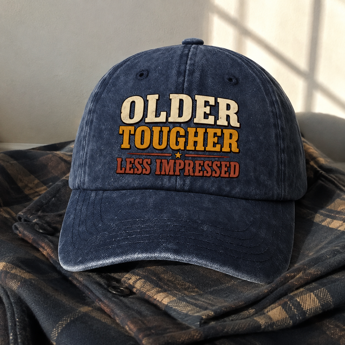 Navy vintage washed cap with printed Older Tougher Less Impressed slogan front view