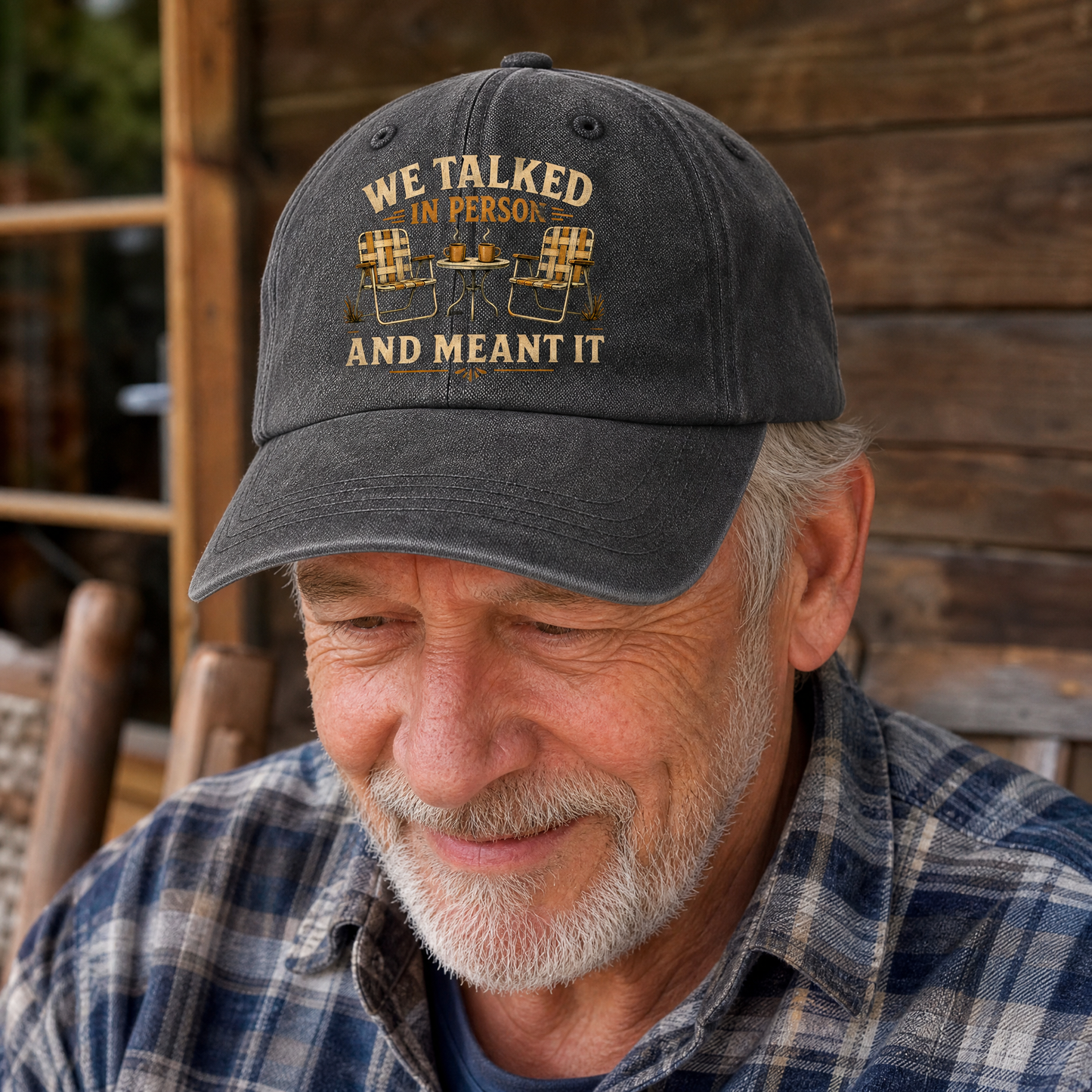 Senior man wearing a vintage washed cap with printed “We Talked in Person” design, lifestyle view