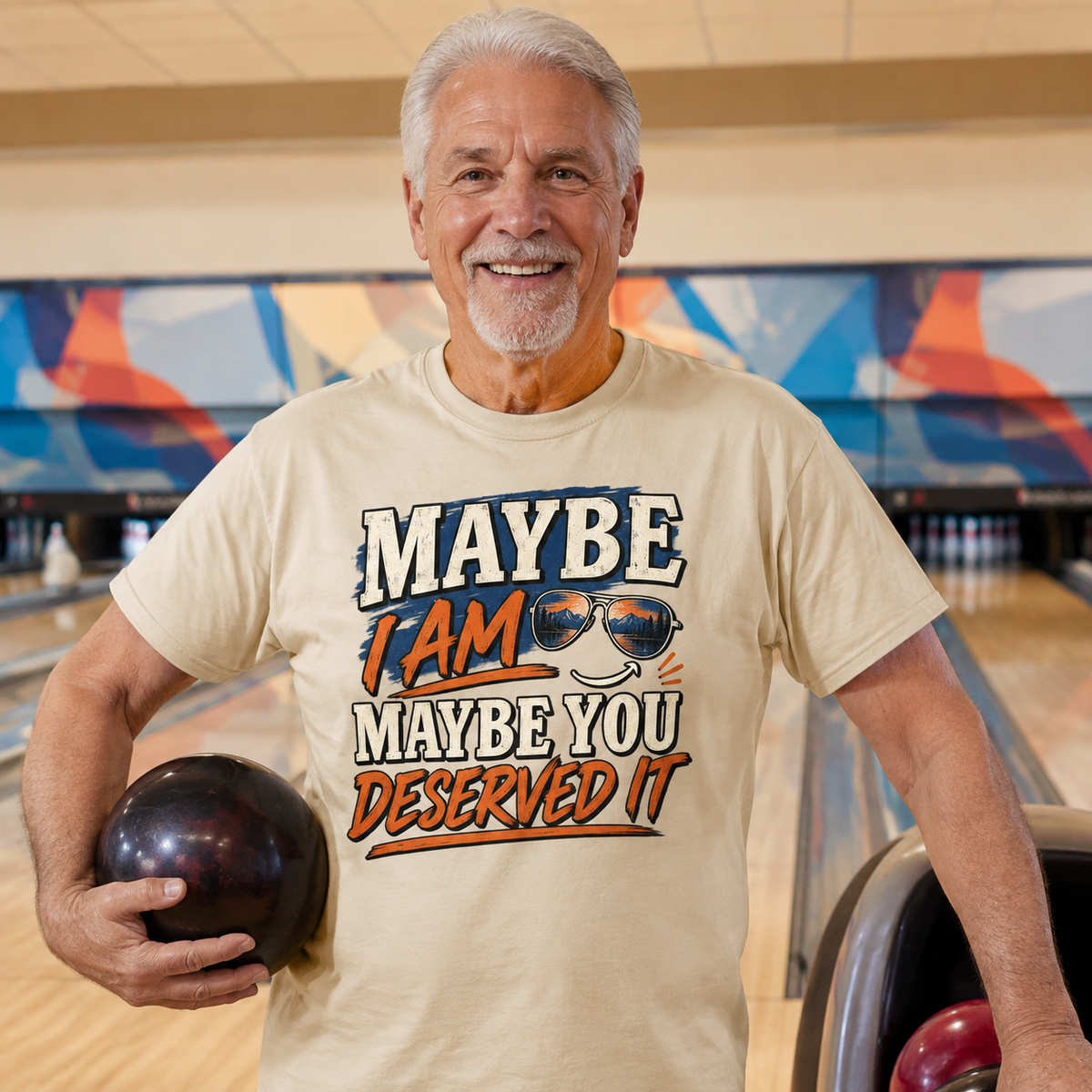 Senior man wearing beige vintage t-shirt with printed Maybe I Am slogan at bowling alley