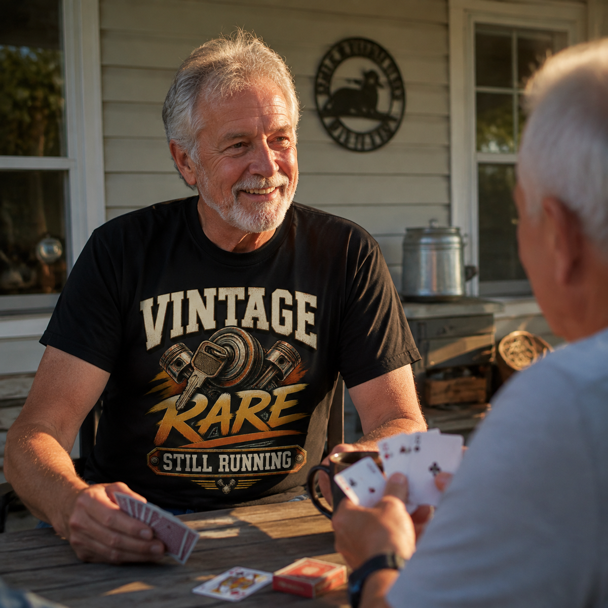 Senior man wearing black vintage t-shirt with printed Vintage Rare Still Running slogan outdoors