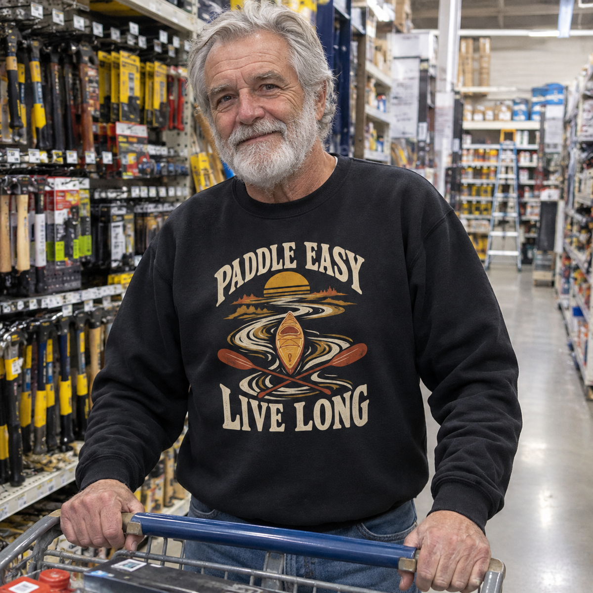 Black vintage sweatshirt with Paddle Easy Live Long print worn by senior man in hardware store