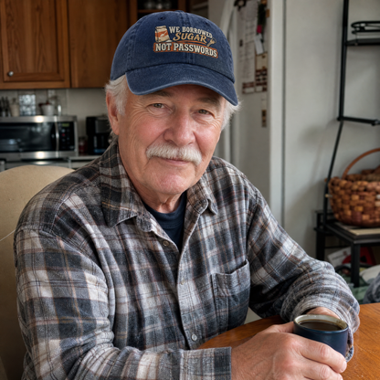 Senior man wearing a navy vintage washed cap with We Borrowed Sugar. Not Passwords print.