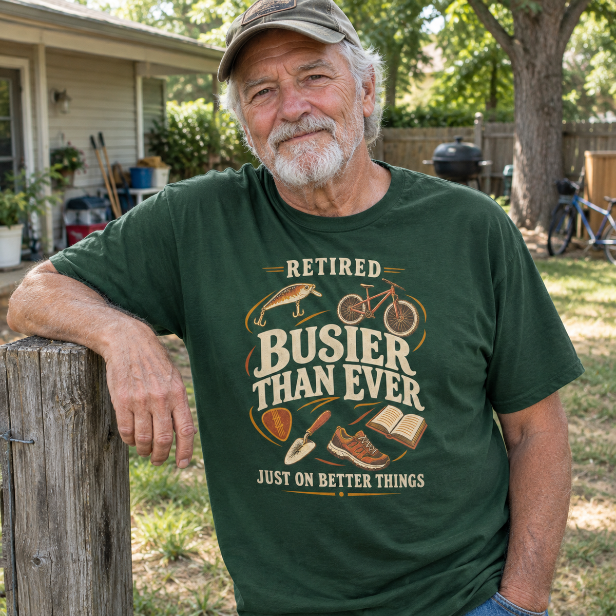 Senior man wearing green vintage t-shirt with Retired Busier Than Ever printed design outdoors