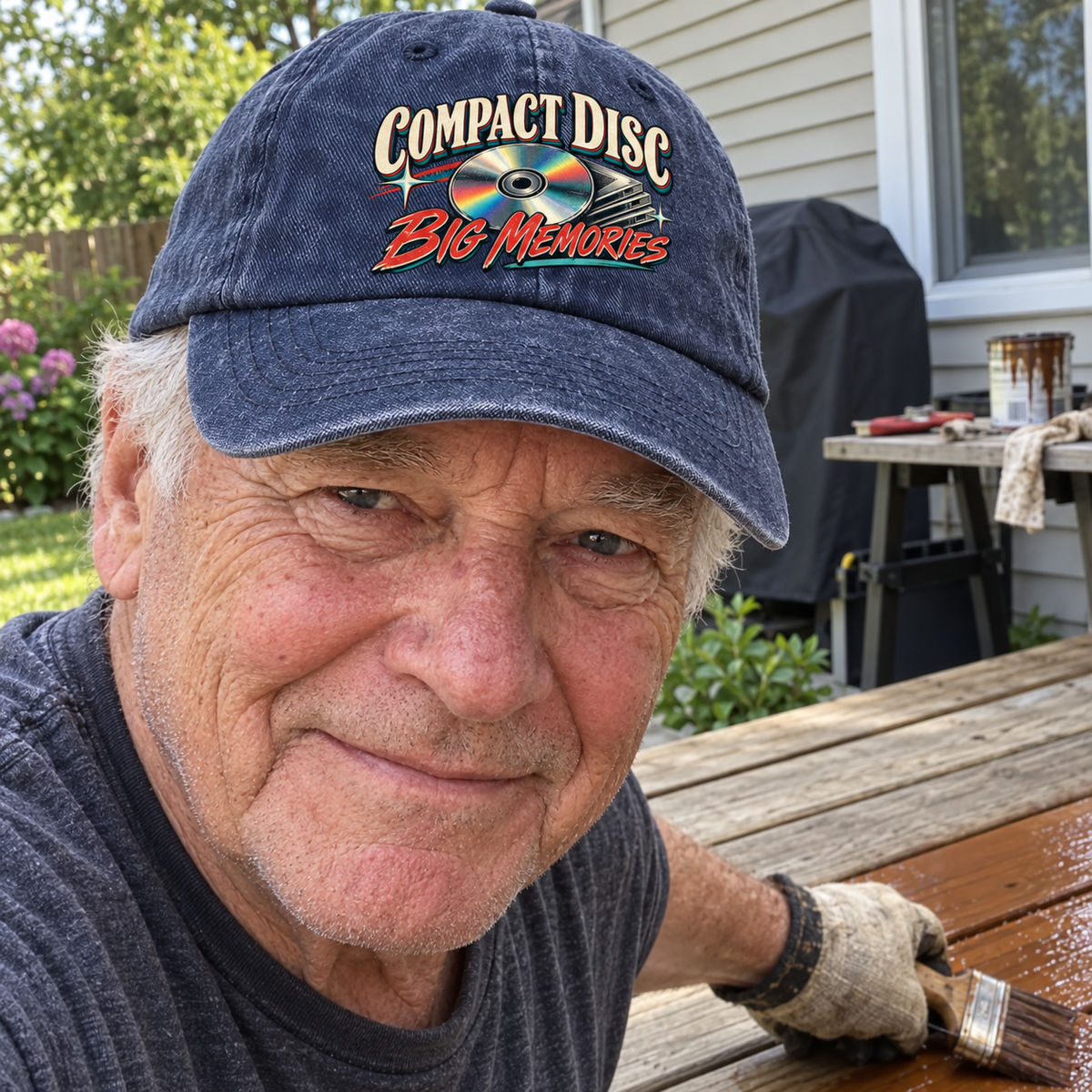 Senior man outdoors wears navy vintage washed cap with printed Compact Disc Big Memories slogan