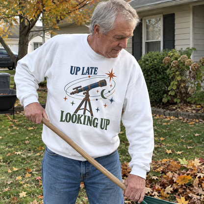 White vintage sweatshirt with printed Up Late Looking Up design worn by senior man outdoors