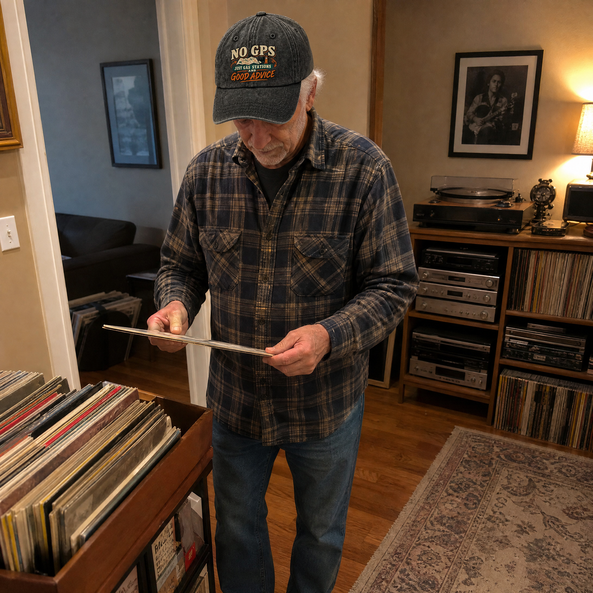 Senior man wearing a black vintage washed cap with printed No GPS slogan indoors