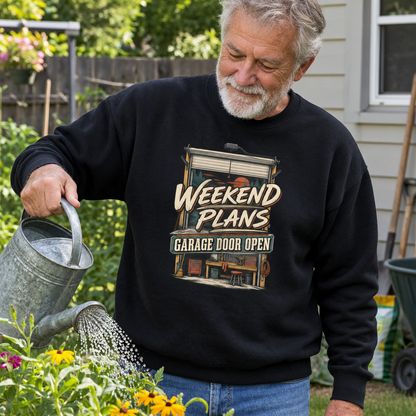 Black vintage sweatshirt with Weekend Plans Garage Door Open print, worn by senior man gardening.