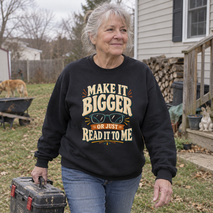 Senior wearing vintage sweatshirt with Make It Bigger Or Just Read It To Me printed design