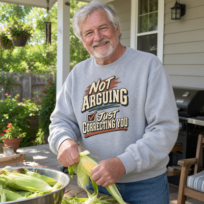 Senior man wearing gray vintage sweatshirt with printed Not Arguing Just Correcting You slogan.