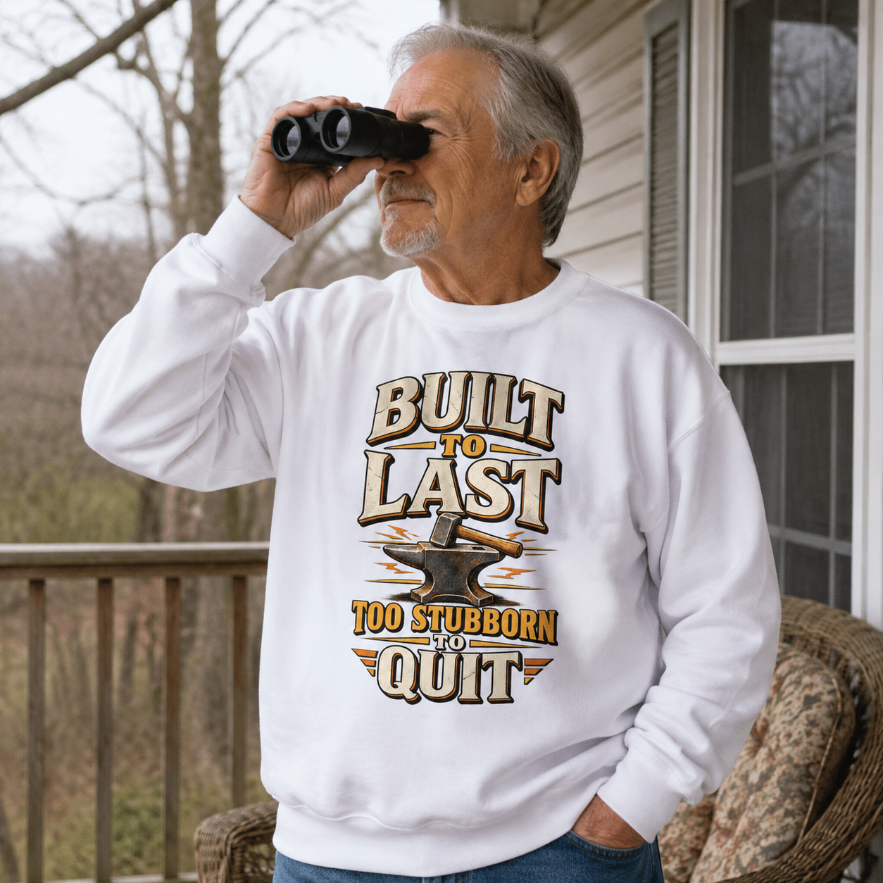 Senior man wearing white vintage sweatshirt with printed Built To Last slogan outdoors