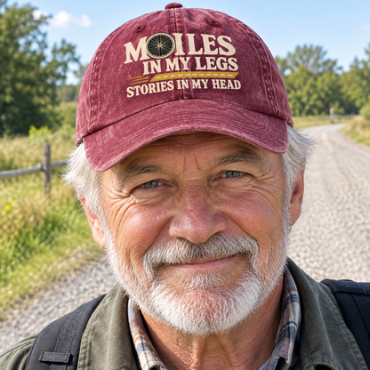 Burgundy vintage washed cap with printed slogan on senior man outdoors beside rural road