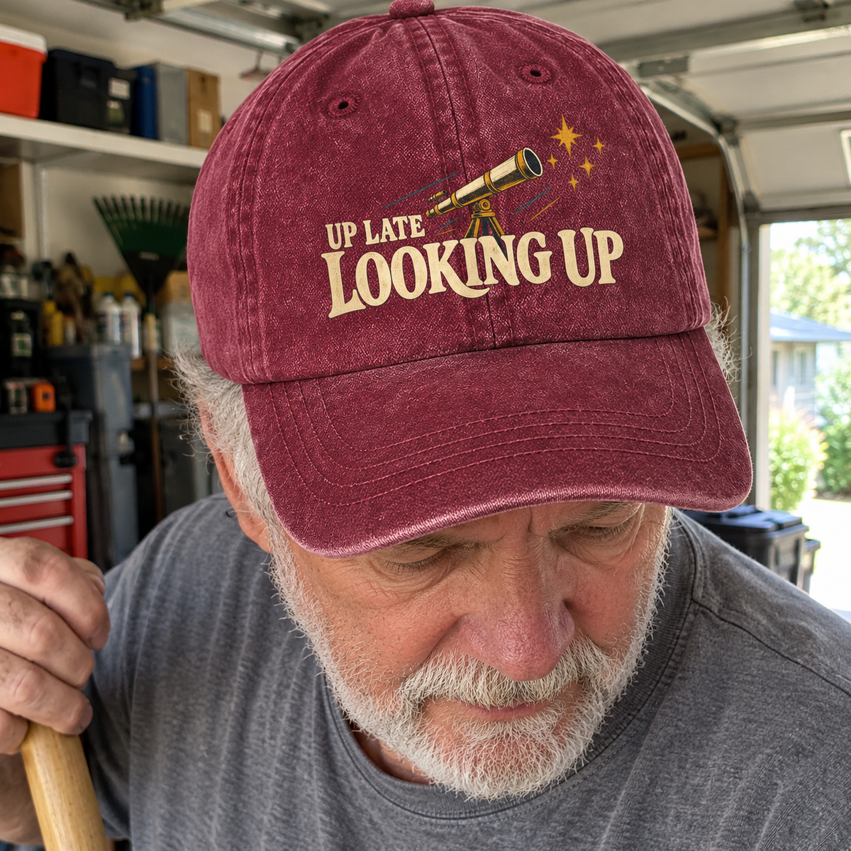 Burgundy vintage washed cap with printed Up Late Looking Up design, worn by senior man outdoors