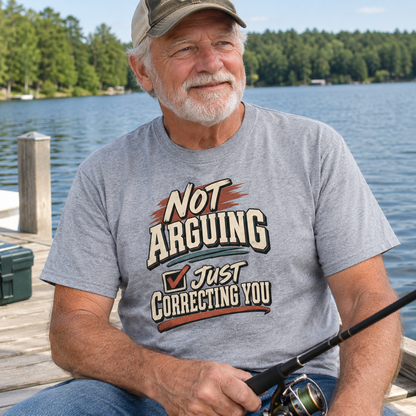 Gray vintage t-shirt with printed “NOT ARGUING Just Correcting You” worn by senior man fishing