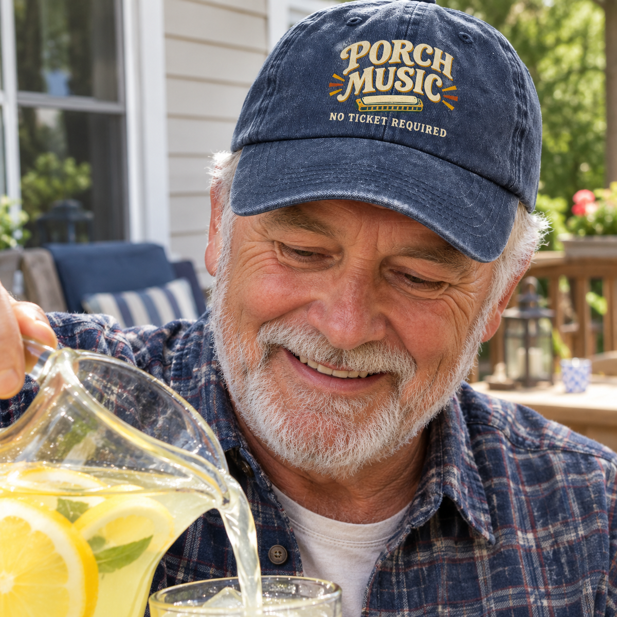 Navy vintage washed cap with Porch Music. No Ticket Required printed design, senior man outdoors