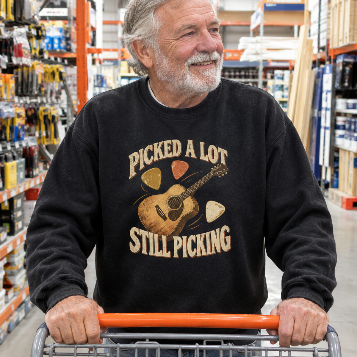 Senior man wearing black vintage sweatshirt printed with Picked A Lot Still Picking guitar design