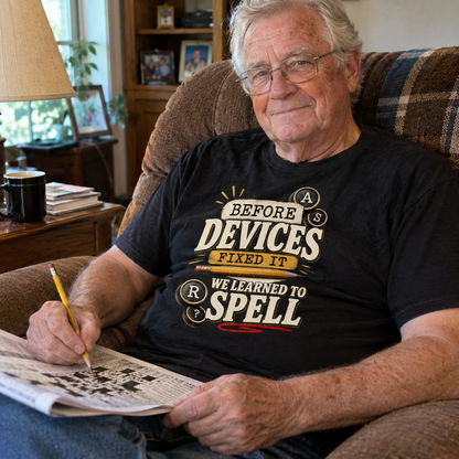 Senior man wearing black vintage t-shirt with printed spelling slogan, solving a crossword puzzle
