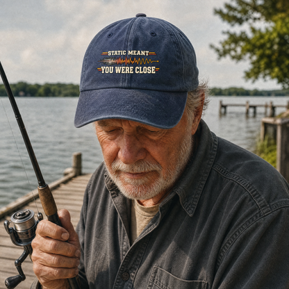 Blue vintage washed cap with printed Static Meant You Were Close slogan, senior angler