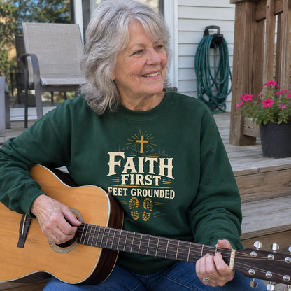 Senior woman plays guitar outdoors wearing green vintage sweatshirt printed Faith First Feet Grounded.