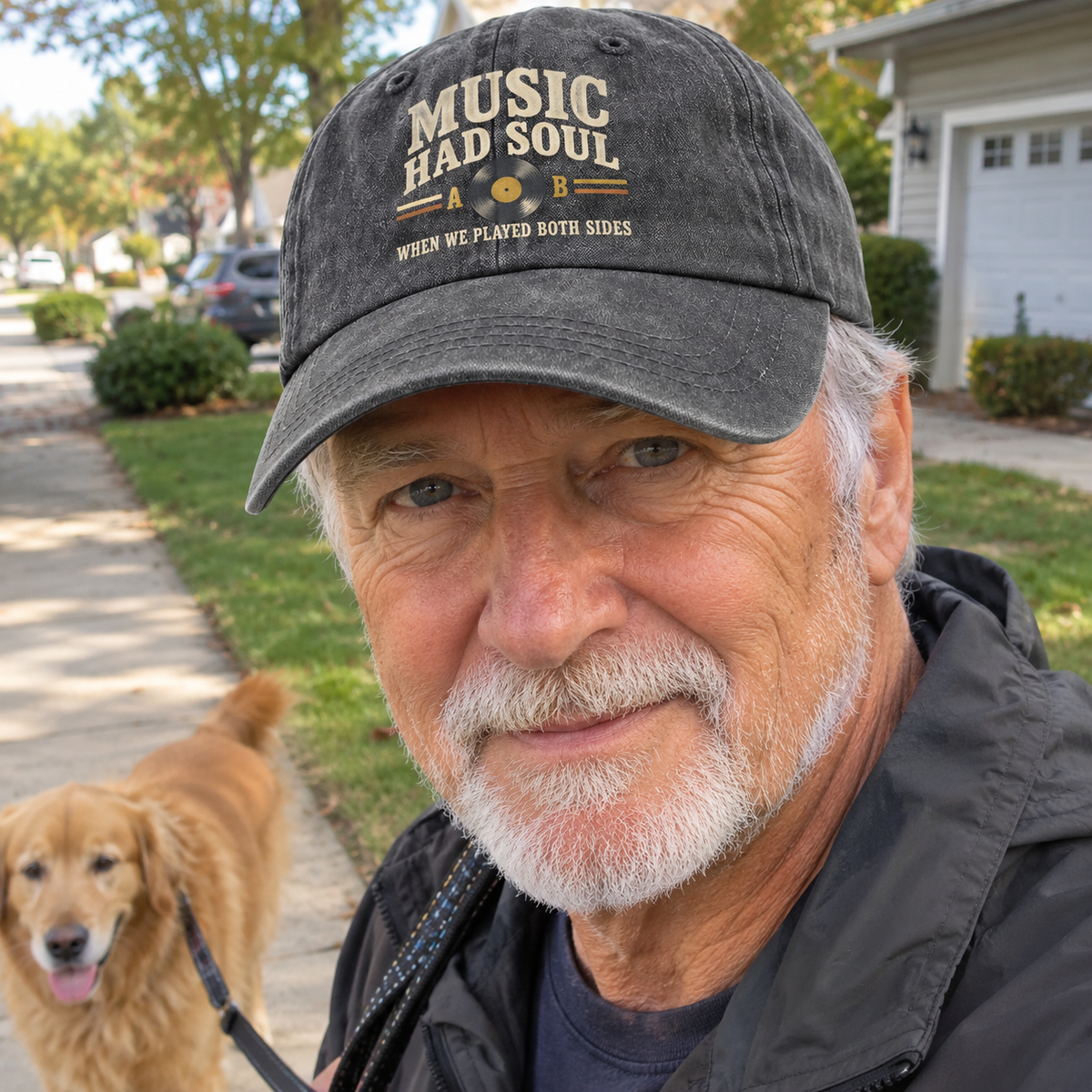 Dark gray vintage washed cap with printed music slogan worn by senior man walking a dog outdoors