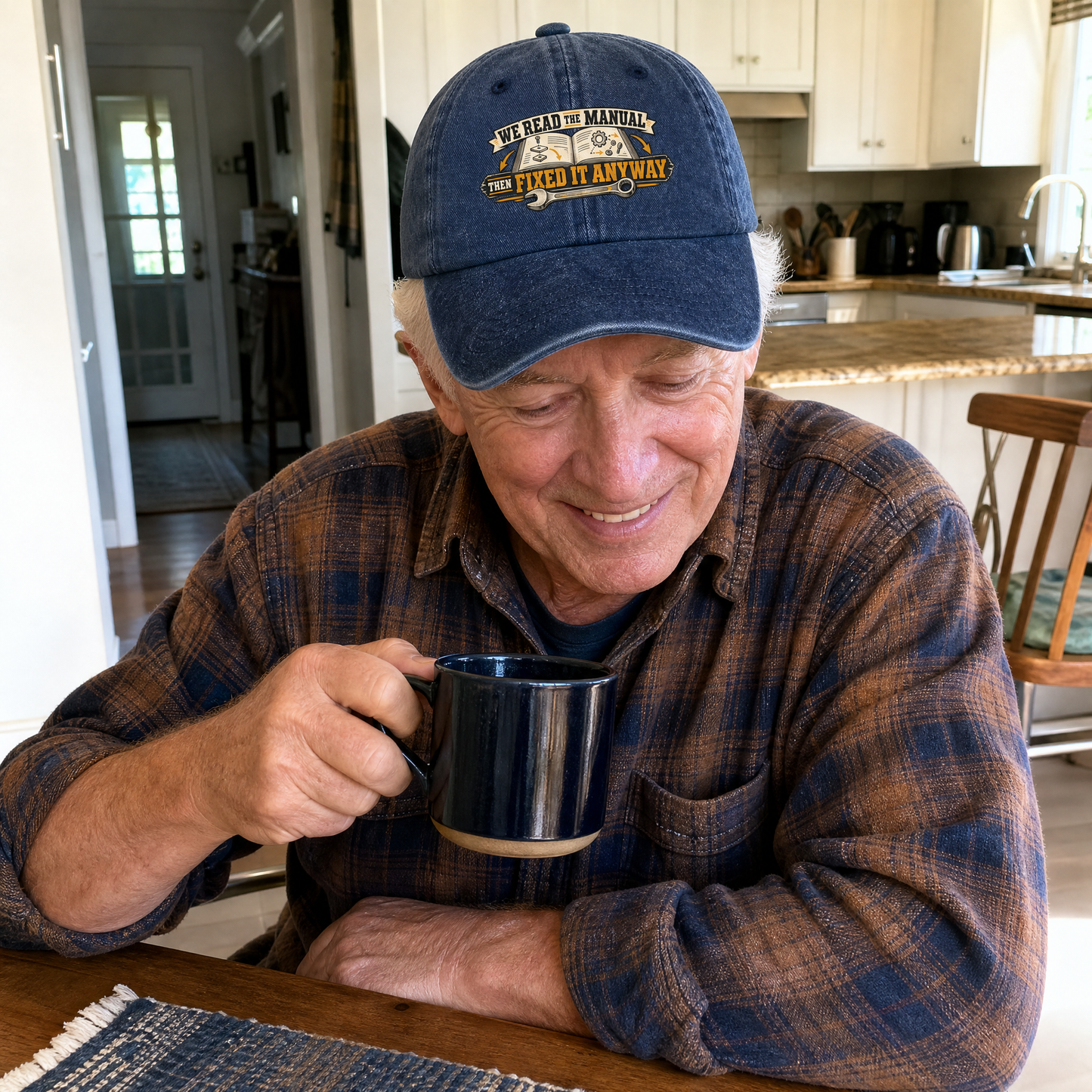 Blue vintage washed cap with printed “We Read The Manual Then Fixed It Anyway” slogan.