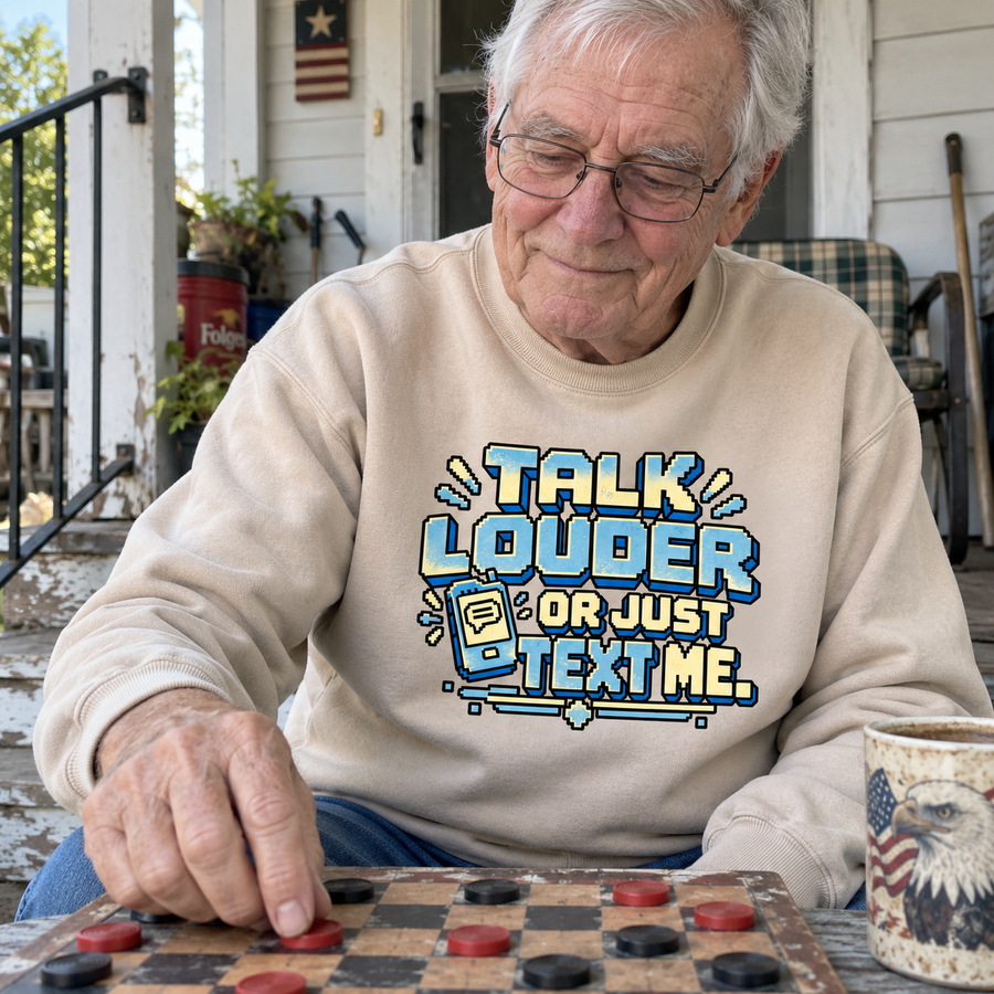 Senior man playing checkers in beige vintage sweatshirt printed Talk Louder Or Just Text Me