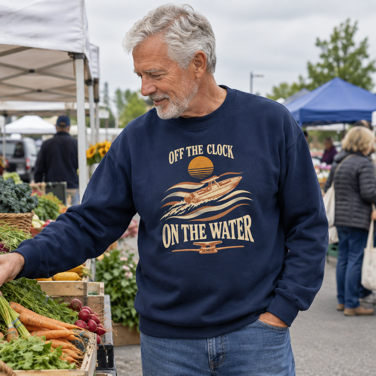 Senior man wearing navy vintage sweatshirt with printed boat design and slogan at outdoor market