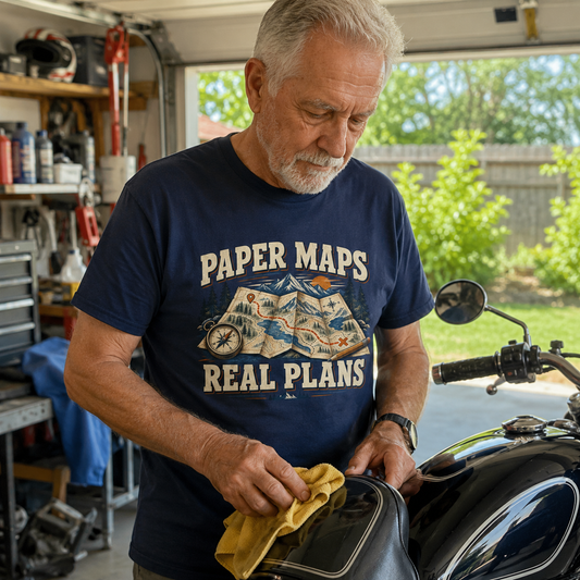 Navy vintage t-shirt with printed Paper Maps Real Plans design, worn by senior man.