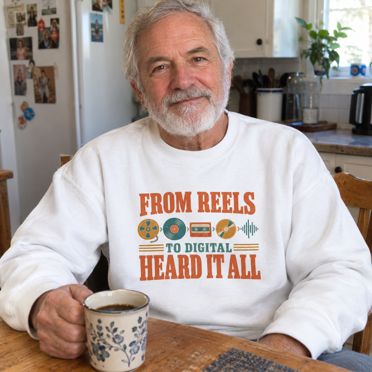 Vintage sweatshirt with printed “From Reels To Digital Heard It All,” worn by senior man.