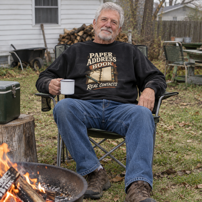 Black sweatshirt with printed Paper Address Book Real Contacts slogan worn by senior man outdoors.