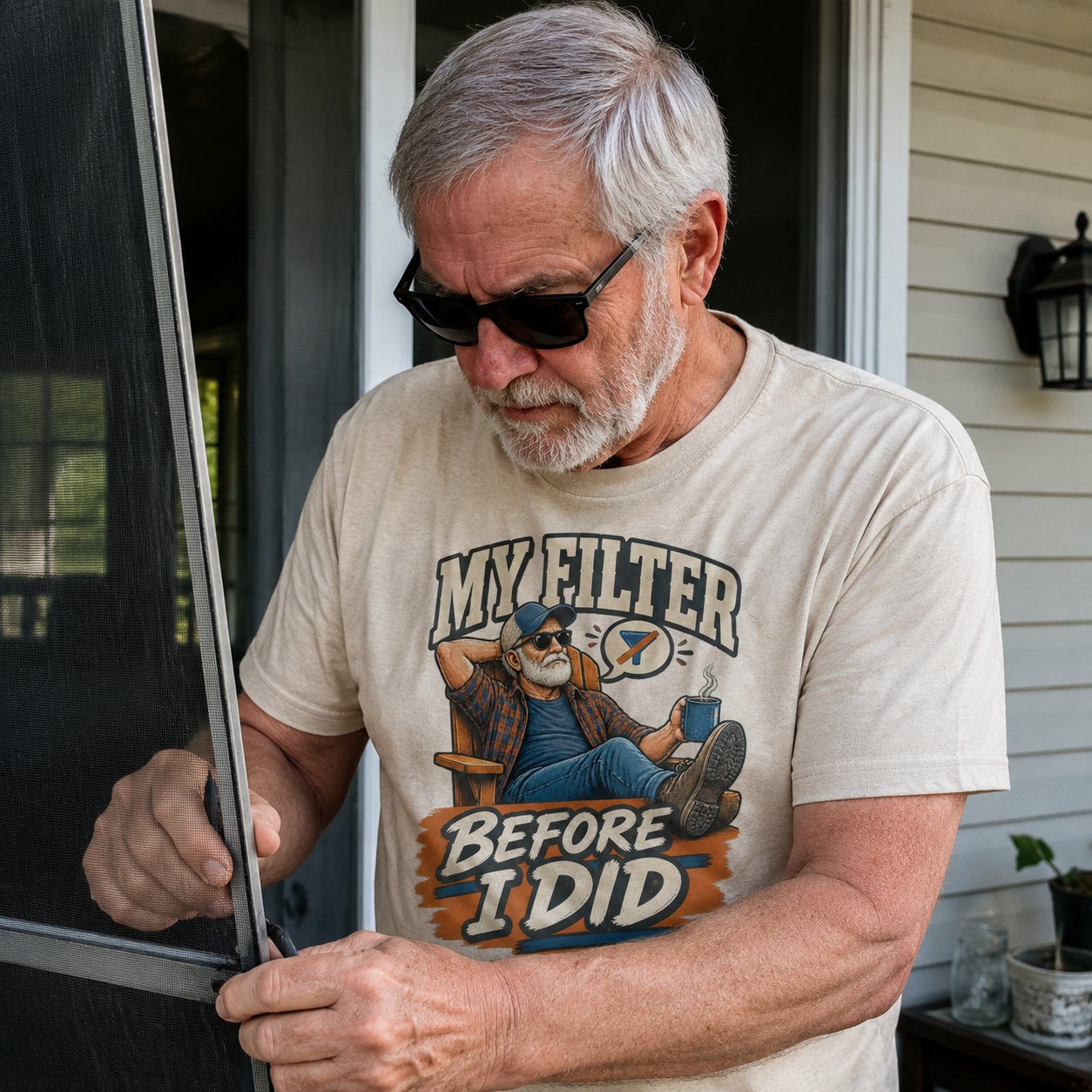 Senior man wearing cream vintage t-shirt with My Filter Before I Did printed design outdoors