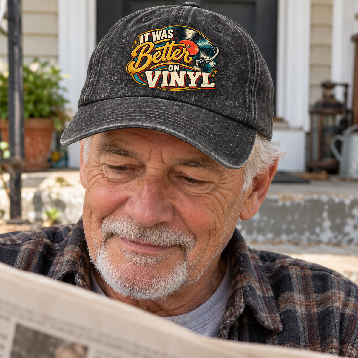 Senior man wears black vintage washed cap printed with It Was Better On Vinyl