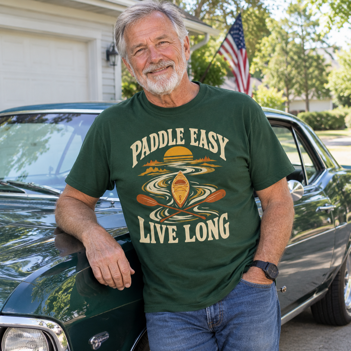 Senior man wearing dark green vintage t-shirt with printed Paddle Easy Live Long design