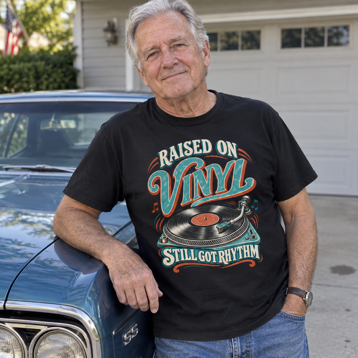 Senior man wears black vintage t-shirt with printed Raised On Vinyl Still Got Rhythm design.