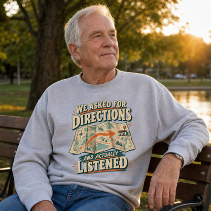 Senior man wearing gray vintage sweatshirt with printed “We Asked For Directions And Actually Listened”